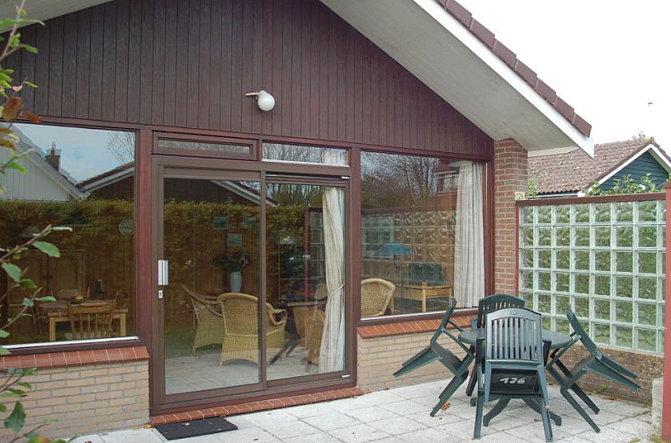 Enjoy the sunny terrace at Holiday home Slufterhoek 126 in De Cocksdorp, Texel.