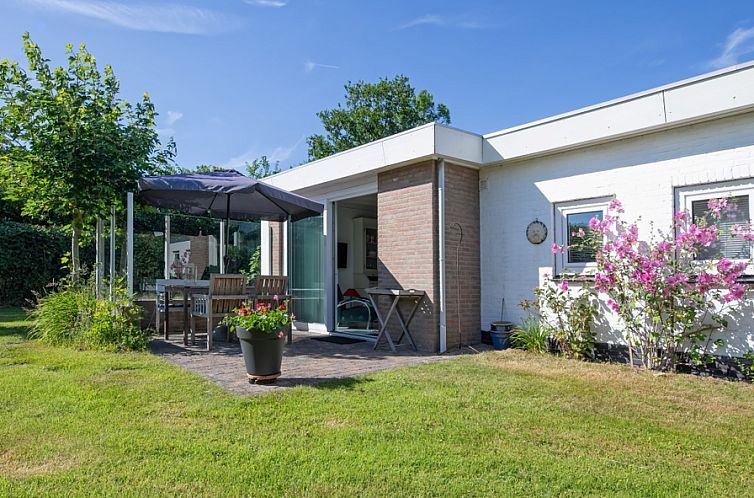 Enjoy the sunny garden at Bungalowpark Slufteroord, Holiday home Slufteroord 300 in De Cocksdorp, Texel.
