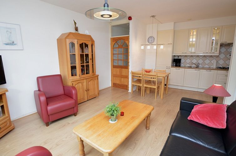 Cozy living room in Apartment Kerckeland 110, De Koog, Texel, with comfortable seating area.