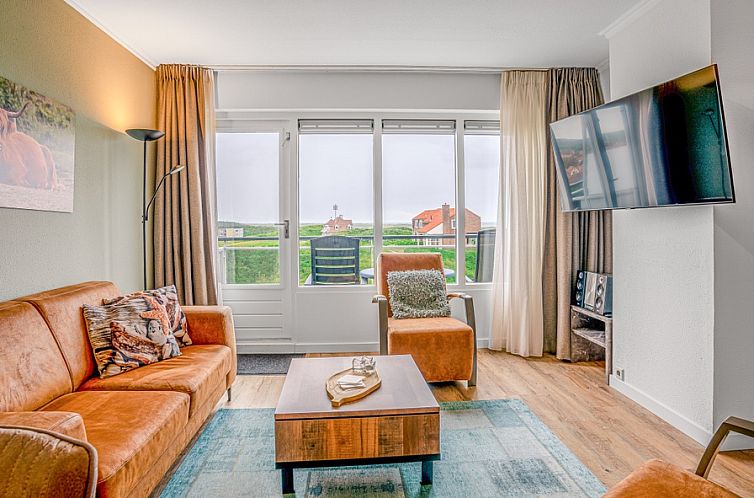 Cozy living room in Apartment Juliana 136 Island and Sea View, De Koog, Texel with views of the Wadden Islands.