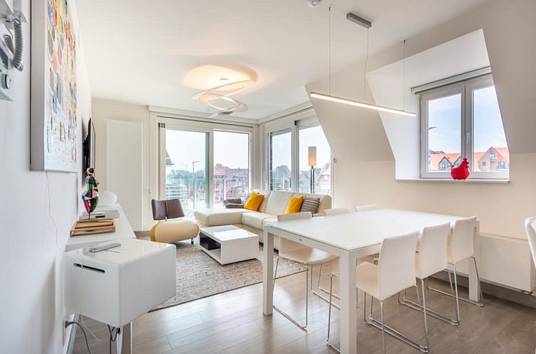 Stijlvolle binnenruimte van Aime 303 vakantiehuis in Koksijde, West-Vlaanderen, met moderne inrichting en veel natuurlijk licht.