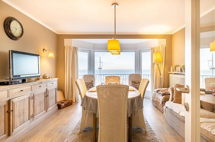 Gemuetliches Wohnzimmer des zweiten Ferienhauses De Golven in Koksijde, Belgien, mit Meerblick und komfortabler Einrichtung.