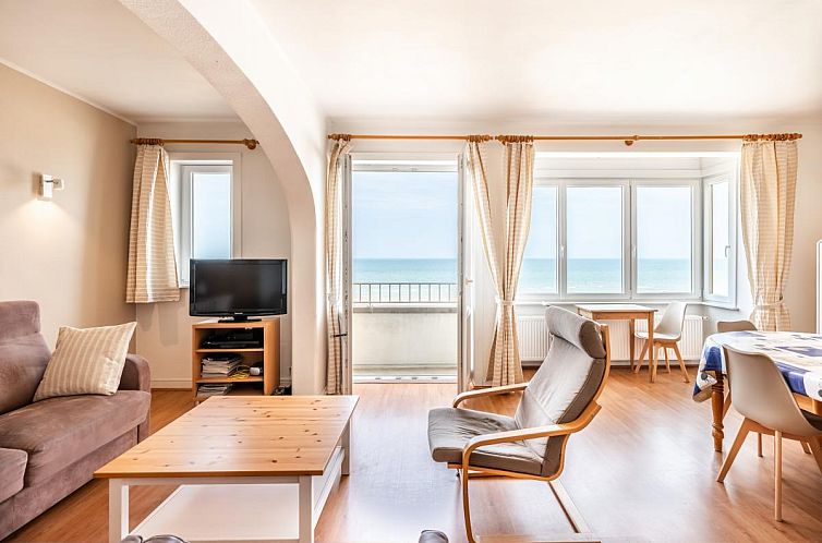 Helles Wohnzimmer des Ferienhauses Nepto troisieme in Koksijde, Westflandern, mit Meerblick und gemuetlicher Sitzecke.