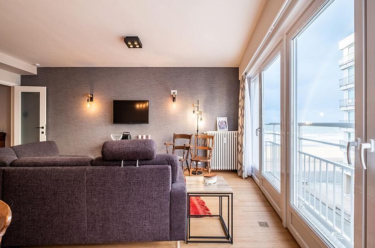 Stilvolles Wohnzimmer des Ferienhauses Neva troisieme in Koksijde, Westflandern, mit Meerblick und moderner Einrichtung.