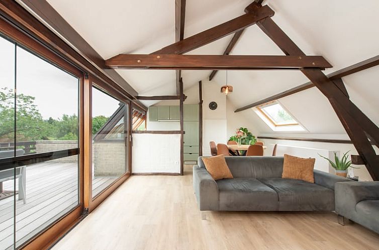 Bright living room with wooden beams in Holiday home in Alveringem, West Flanders, Belgium, ideal for relaxation.