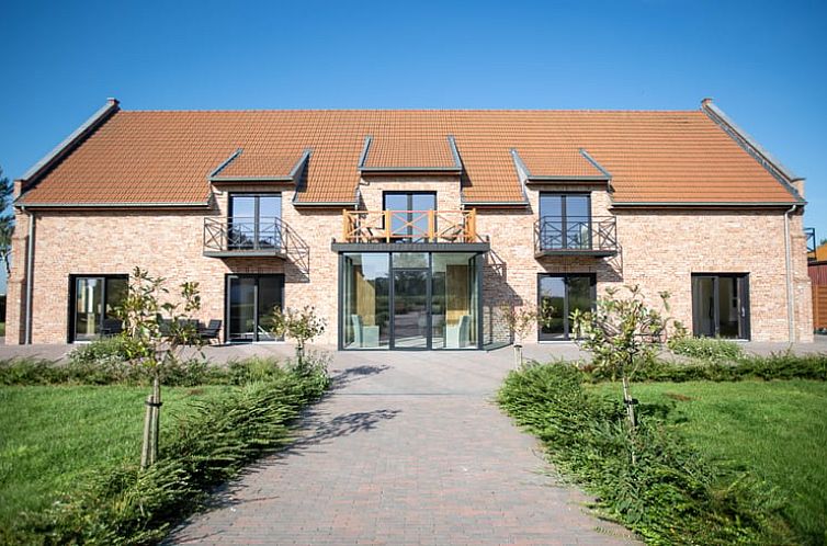 Vakantiehuis in Houthulst, charmant verblijf in West-Vlaanderen met traditionele bakstenen gevel en moderne uitstraling.