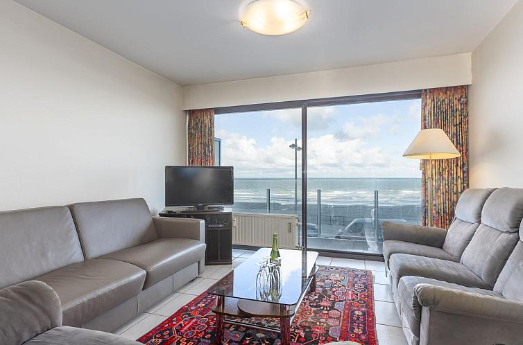 Gemuetliches Wohnzimmer des Ferienhauses De Rede 1 - 0101 in Middelkerke, Westflandern, mit Meerblick und komfortabler Einrichtung.
