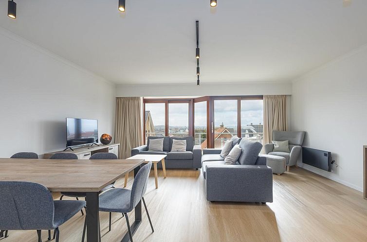 Geraeumiges Wohnzimmer des Ferienhauses "Harmony - 0301" in Middelkerke, Westflandern, mit moderner Einrichtung und Blick auf die Umgebung.