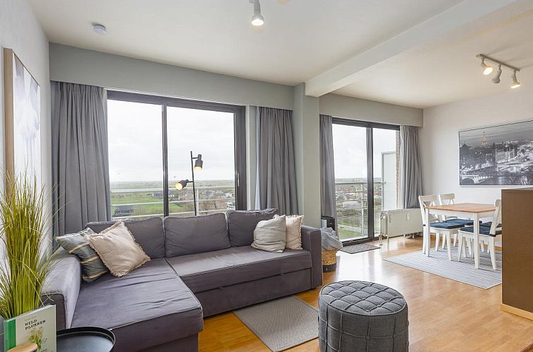 Gemuetliches Wohnzimmer von "De Rede 1 - 0803", einem Ferienhaus in Middelkerke, Westflandern, mit Blick auf die Kueste und einer komfortablen Sitzecke.