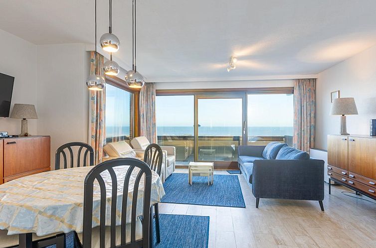 Helles Wohnzimmer des Ferienhauses Dunekant - 0203 + park.6 in Middelkerke, Westflandern, mit Meerblick und gemuetlicher Sitzecke.