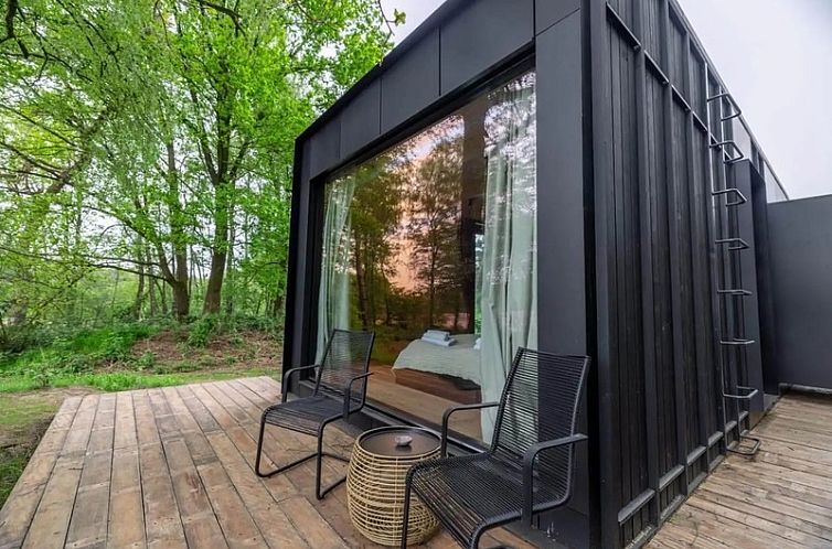 Enjoy the serene surroundings at Nokken Forest Cabin, a stylish vacation home in wooded Wilsum, Lower Saxony, Germany.