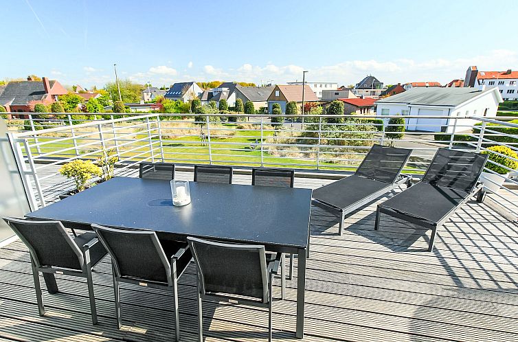 Enjoy the sunny terrace at Apartment Residentie Greens in Bredene, West Flanders, overlooking the green surroundings.