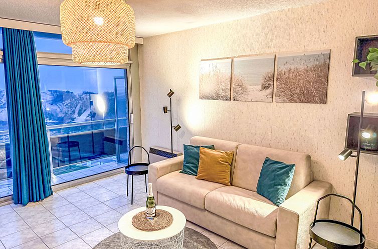 Bright living room of Apartment Studio 806 in Bredene, West Flanders, Belgium, overlooking the dunes from the balcony.