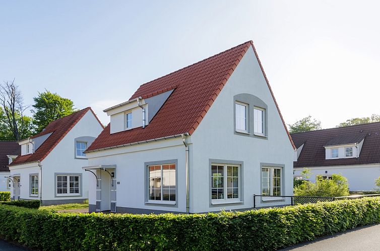 Vacation home Dog Bungalow 6 Comfort in Bad Bentheim, Germany, with sunny exterior and green surroundings.