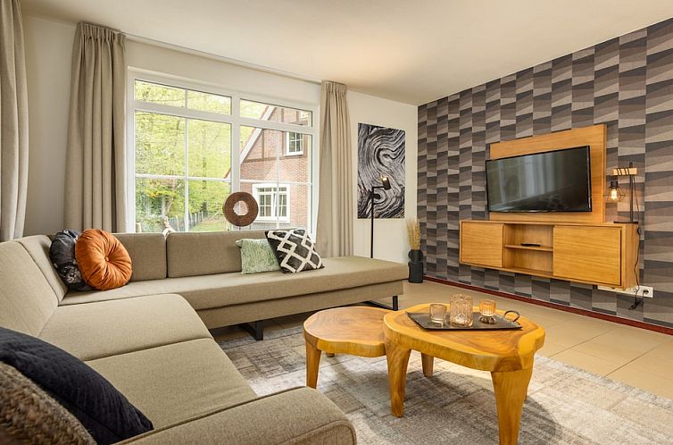 Stylish interior of BBL4 Comfort vacation home in Bad Bentheim, Lower Saxony, with comfortable seating area.