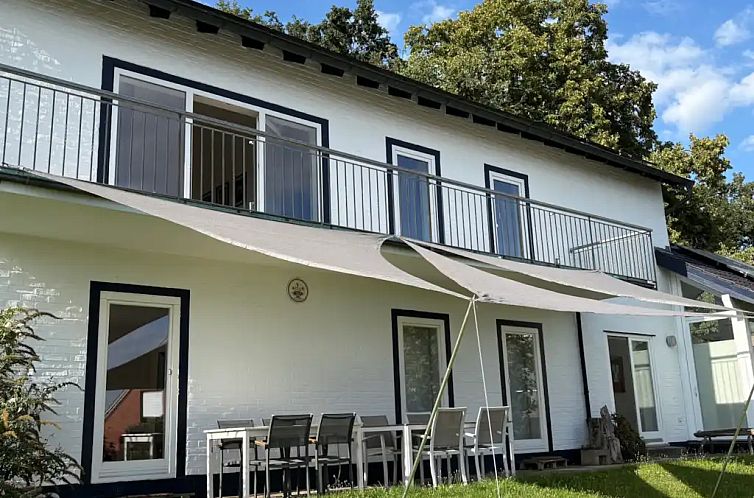 Enjoy the sun on the patio of the ELF vacation home in Bad Bentheim, surrounded by nature.
