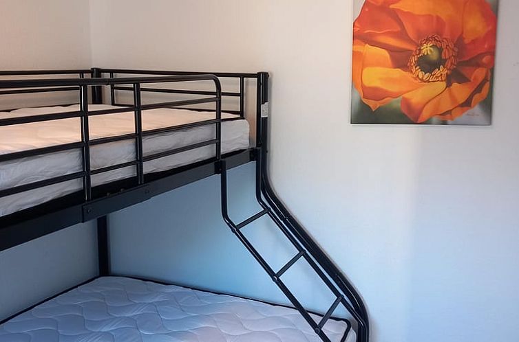 Stylish bedroom with bunk beds in Holiday Home in Joachimsthal, perfect for a family vacation near Berlin, Germany.