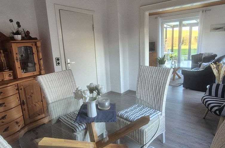 Vakantiehuis mit Wintergarten und Garten am Deich