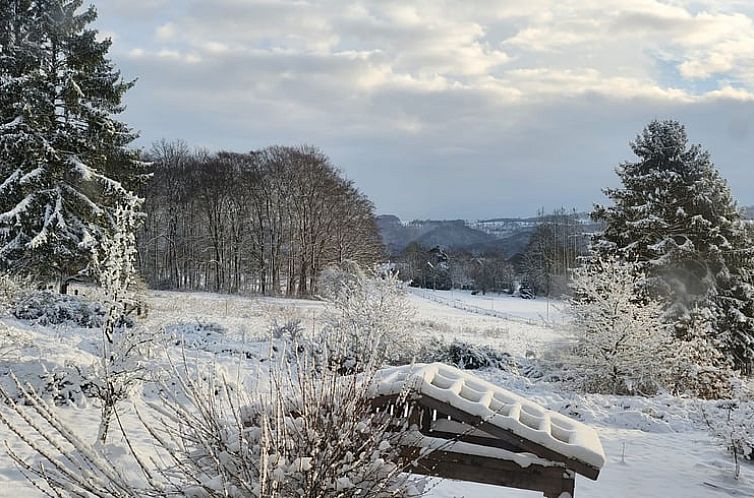 Snow covers the surroundings of Cottage in Windeck, a charming vacation home in Windeck, North Rhine-Westphalia.