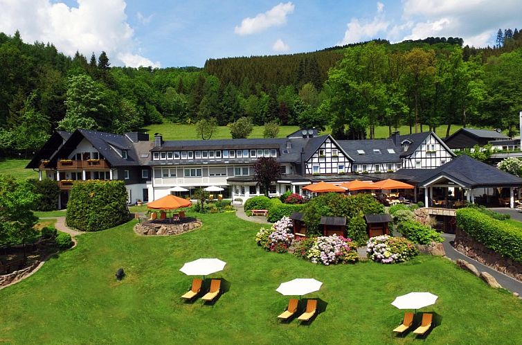 Discover Hotel Haus Hilmeke in Lennestadt, Sauerland, with its lush garden and traditional architecture.