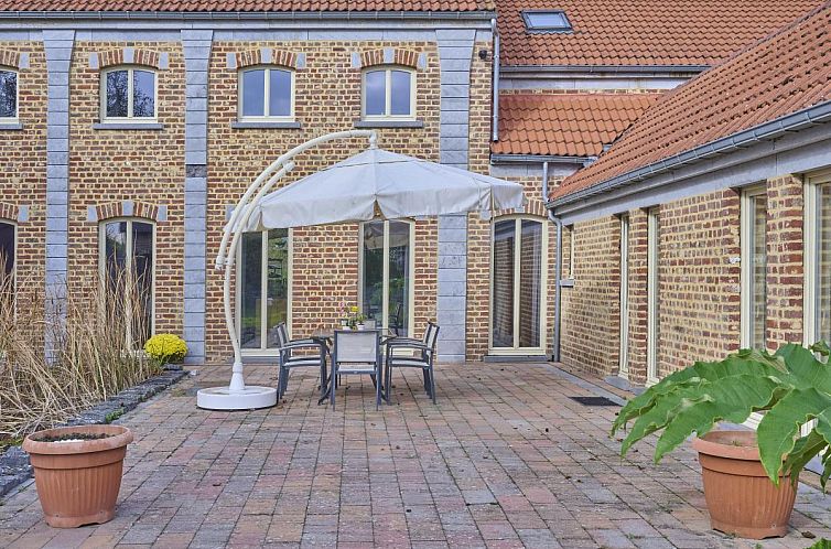 Quanto B vakantiehuis in Geetbets, Vlaams-Brabant met zonnig terras en vijver omgeven door natuur.