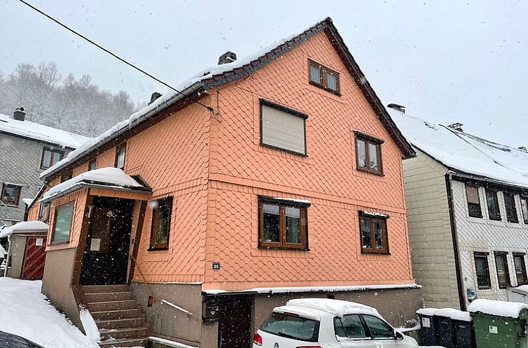 Cozy Holiday Home in Suhl, located in the snowy region of Thuringia, Germany, with charming facade and serene atmosphere.
