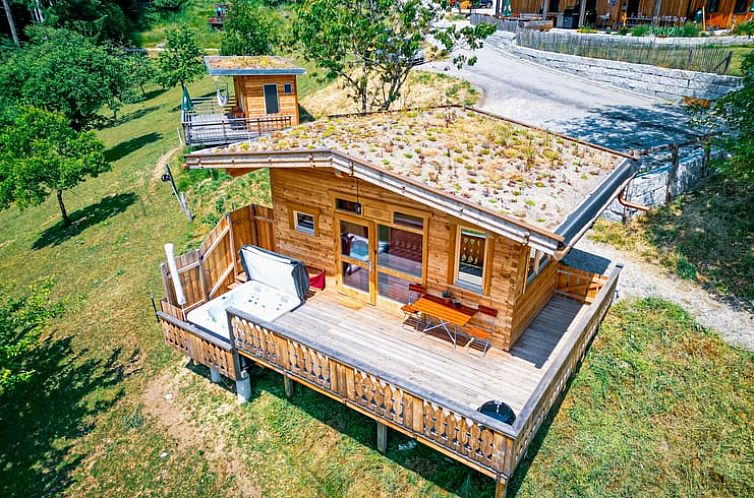 Cozy chalet Cottage in Reut in Bavaria, Germany, with stunning views from the wooden terrace.