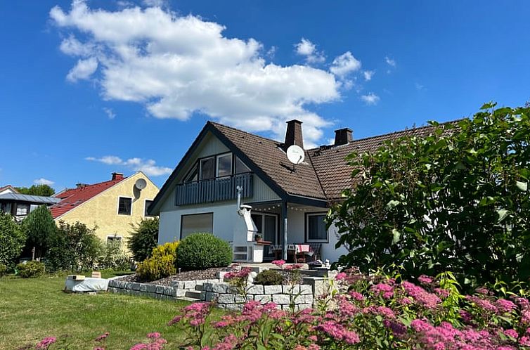 Cozy cottage in Schonwald with sunny terrace and green surroundings in Bavaria, Germany.