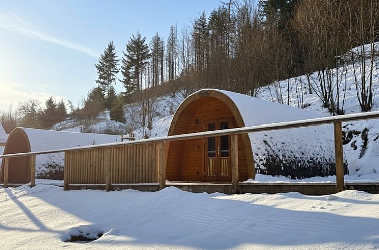 Ferienhaus in Wilhelmsthal, Bayern, mit schoener Terrasse und gruener Umgebung.