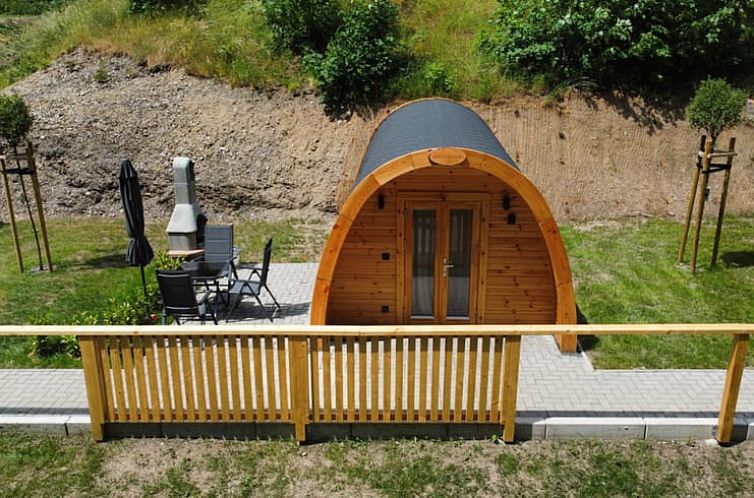 Vacation home in Wilhelmsthal, Bavaria, offers a cozy chalet experience with an inviting terrace and natural surroundings.