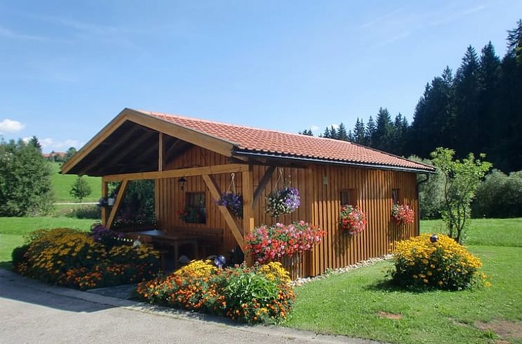 Vacation home Cottage in Rohrnbach, Bavaria, amidst lush flowers and serene nature.