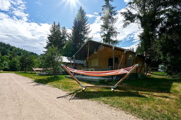 Escape to Wood, a charming safari tent in Sainte-Sigolene, Auvergne, with an inviting veranda and serene setting.