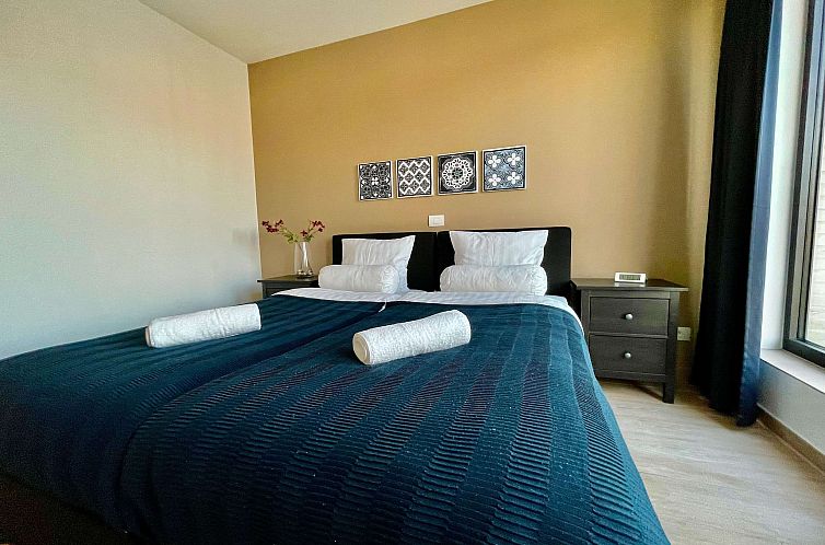 Modern 2BR 1/5 BA Near Diamond District by OneLuxStay