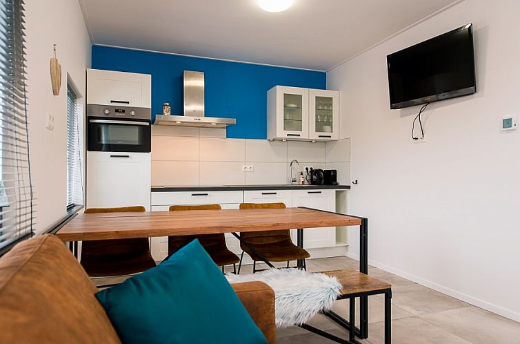 Modern kitchen and dining area in vacation home Onder de Pannen! in Hollum, Ameland.