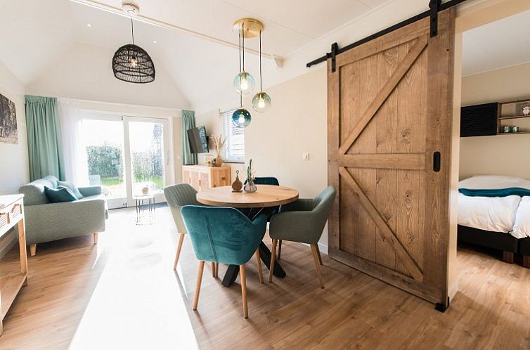 Gemuetliches Wohnzimmer von Daalders slice flat in Hollum, Ameland mit heller und moderner Einrichtung.