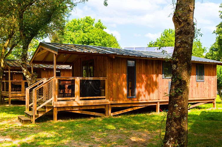 Discover Lodge Premium VIP in Saumur, Pays de la Loire, a charming vacation home with an inviting terrace and green surroundings.