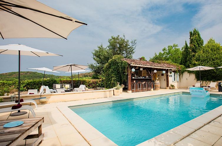 Relax by the pool at Lavende, a vacation home in Degagnac, Midi Pyrenees, with stunning views of the green surroundings.
