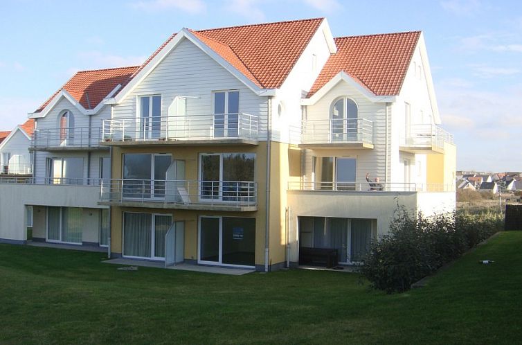 Charming Coquille Opale residence in Wimereux, France, with modern architecture and serene garden.