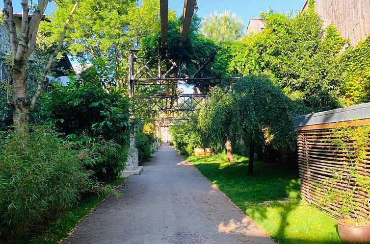 Enjoy the serenity surrounding Cosy Loft 5min Paris, a vacation rental in Ivry-sur-Seine, near the heart of Paris.