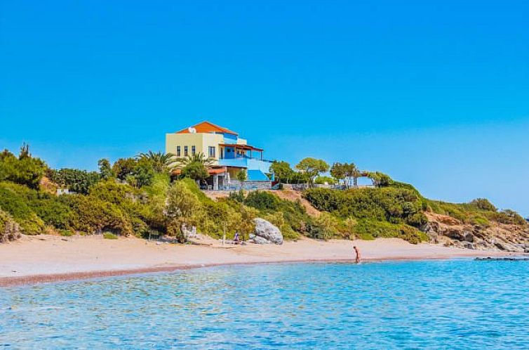 Enjoy the serene coastline at Apartments Paraktio, located in Kiotari in the Greek Islands, with beautiful sea views.