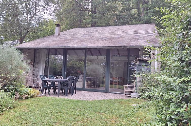 Cottage in Stavelot with spacious veranda and view of green garden, located in the Ardennes, Liege, Belgium.