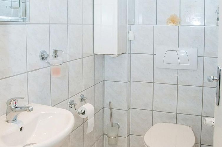 Vakantiehuis Wohnung mit Garten, Grill und Gemeinschaftspool