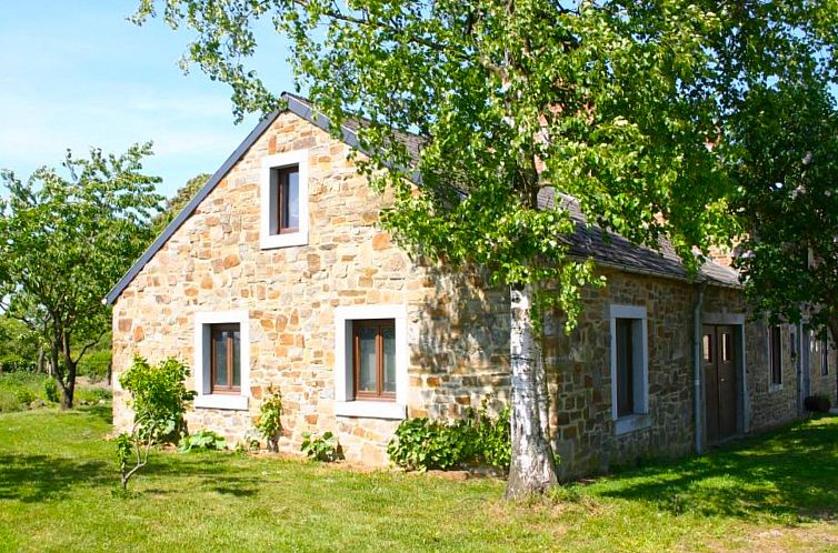 Charming cottage Gite rural Mamijana in Mesnil-Saint-Blaise, Ardennes, Belgium, surrounded by green nature and rustic stone walls.