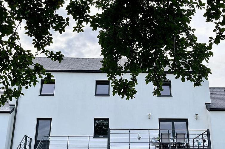 Cottage in Redu, Ardennes with a modern facade and terrace, ideal for a relaxing stay in Luxembourg, Belgium.