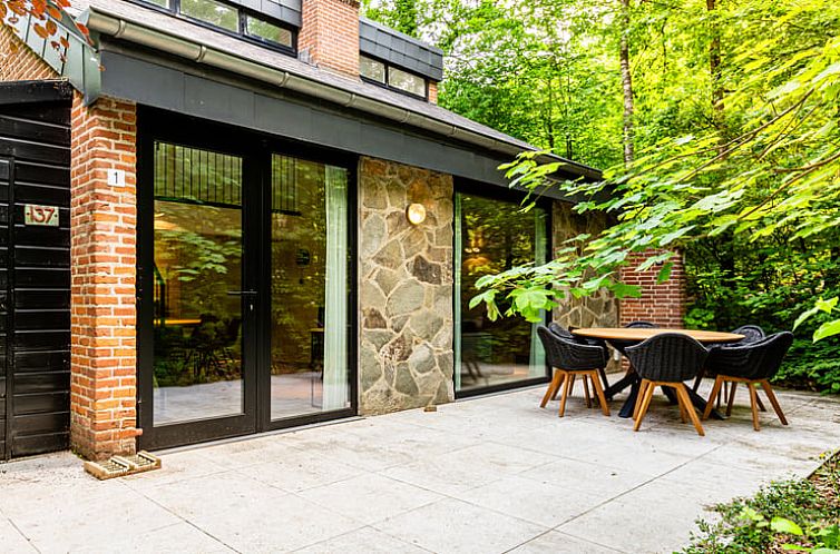 Enjoy the peace and quiet on the terrace of Cottage in Izier, a vacation home in the Ardennes, Durbuy, surrounded by greenery and nature.