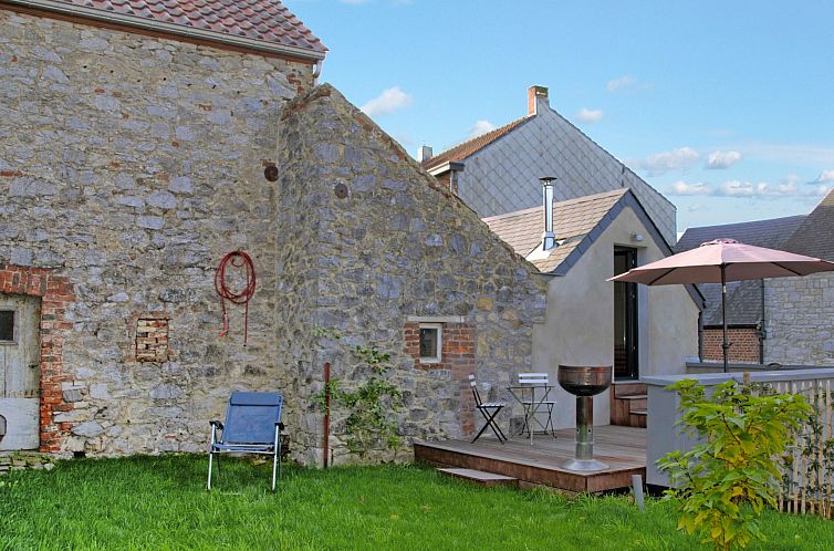 Rustic charm at Holiday Home Le Ti' Bauduin in Thy-le-Bauduin, Ardennes, Belgium with sunny terrace and green garden.
