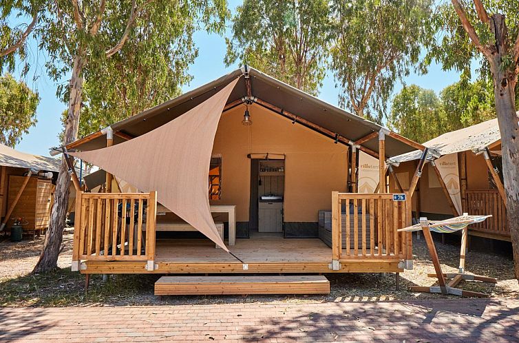 Enjoy the serene surroundings at Outback, a safari tent in Alghero, Sardinia, with an attractive terrace for relaxation.