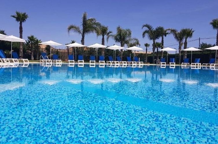 Relax by the sparkling pool at Apartments Hydria, located in beautiful Campofelice Di Roccella, Sicily.