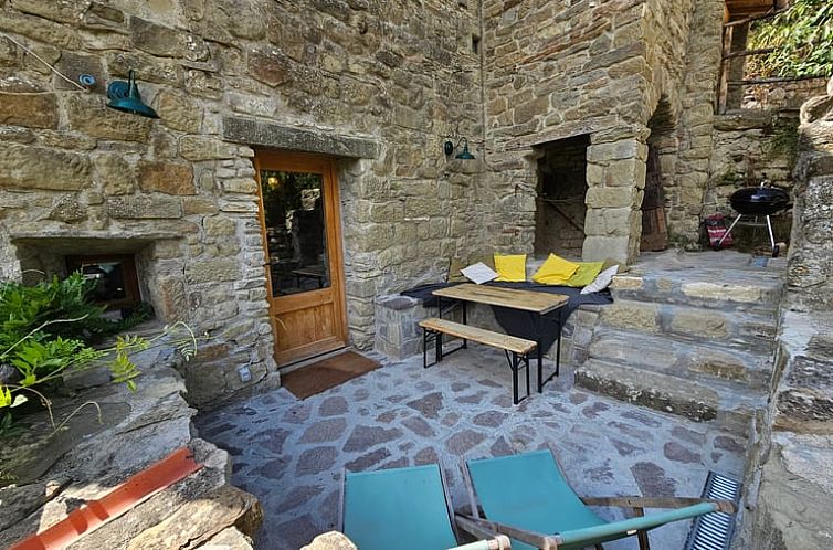 Relax on the cozy veranda of Holiday Home in Gello, Tuscany, Italy, perfect for a peaceful vacation.