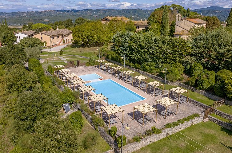 Enjoy the pool overlooking the hills at Agriturismo Poggiovalle Borgo Belvedere in Citta della Pieve, Umbria, vacation home Italy.